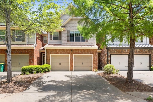 2957 Smith Ridge Trce, Peachtree Corners, GA 30071 - view of front of home with a standing seam roof, a garage, and concrete driveway