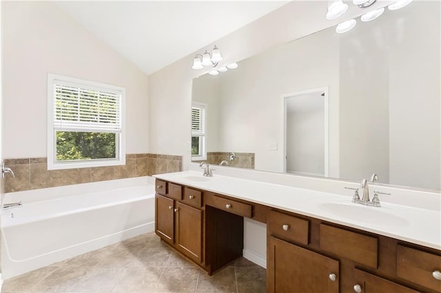 2957 Smith Ridge Trce, Peachtree Corners, GA 30071 - bathroom with lofted ceiling, double vanity, a chandelier, a garden tub, and tile patterned flooring