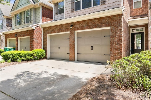 2957 Smith Ridge Trce, Peachtree Corners, GA 30071 - doorway to property featuring an attached garage, concrete driveway, and brick siding