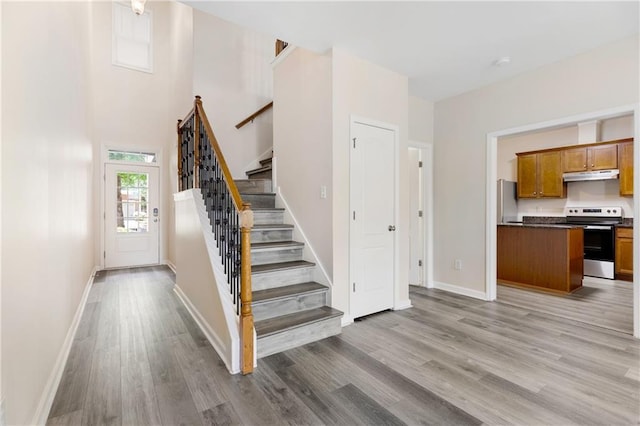 2957 Smith Ridge Trce, Peachtree Corners, GA 30071 - staircase featuring wood finished floors and baseboards