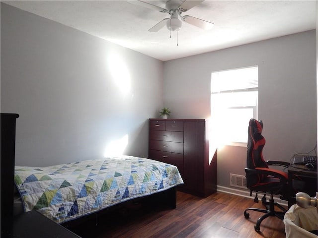 727 Regina Ct, Lawrenceville, GA 30043 - bedroom featuring dark wood-style flooring, a ceiling fan, baseboards, and a desk