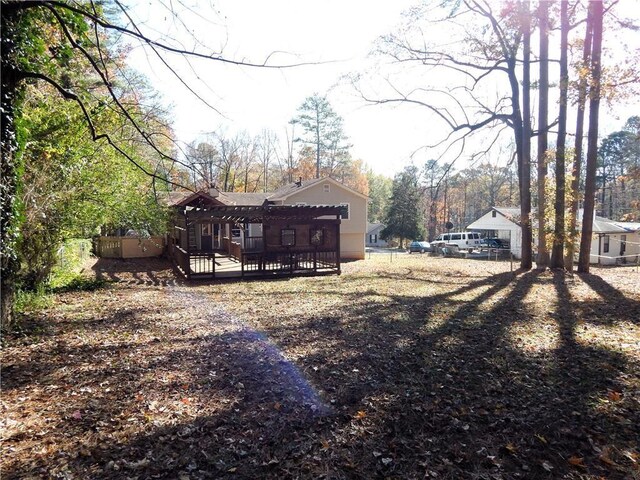 727 Regina Ct, Lawrenceville, GA 30043 - rear view of house featuring a wooden deck
