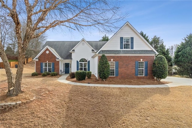 traditional home featuring brick siding