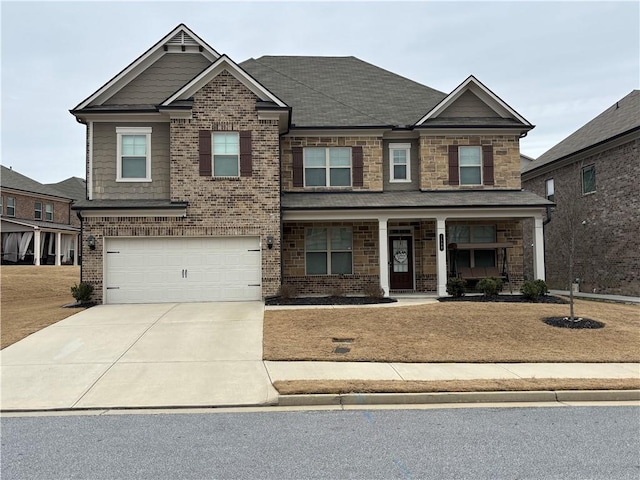 craftsman-style house featuring driveway, stone siding, a garage, and brick siding