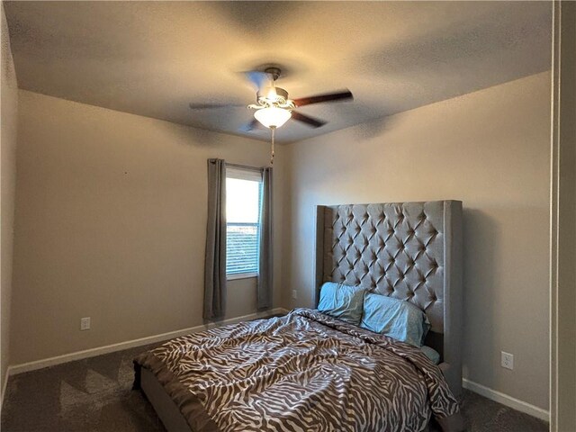 bedroom featuring ceiling fan, carpet floors, a textured ceiling, and baseboards