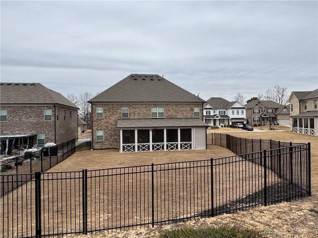 view of front of home with a fenced backyard and a residential view