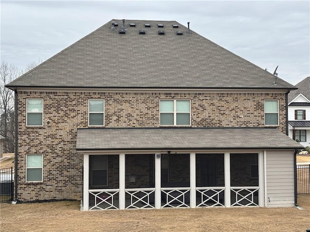 rear view of house with brick siding