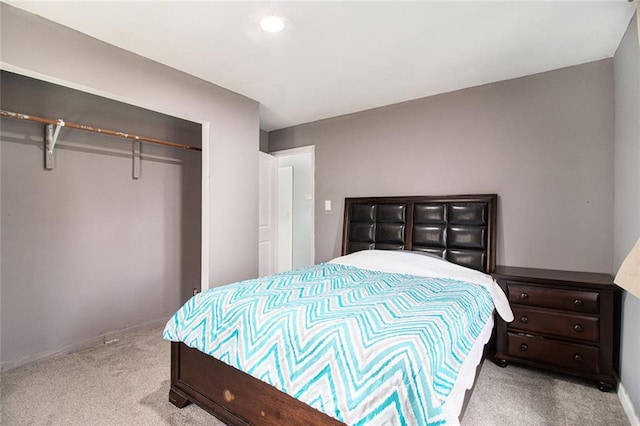 carpeted bedroom featuring a closet