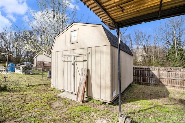 view of shed with a fenced backyard