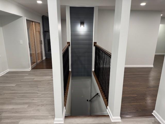 staircase with wood-type flooring