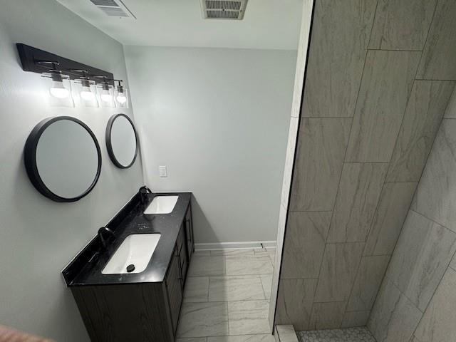 bathroom featuring vanity and walk in shower