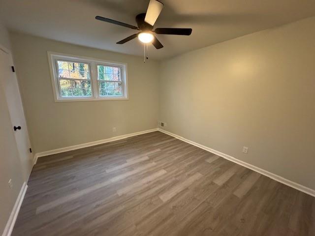 unfurnished room featuring hardwood / wood-style floors and ceiling fan