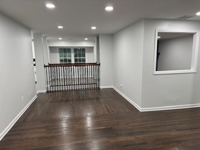 unfurnished room featuring dark hardwood / wood-style floors