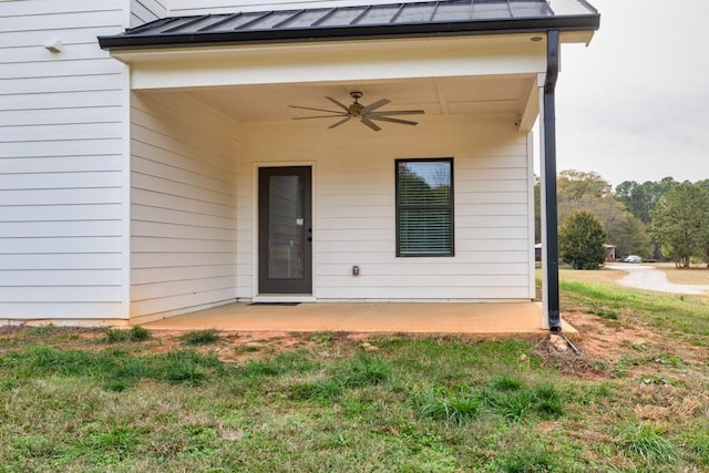 doorway to property featuring ceiling fan and a patio area