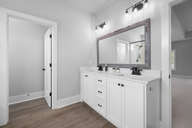 bathroom featuring hardwood / wood-style floors and vanity