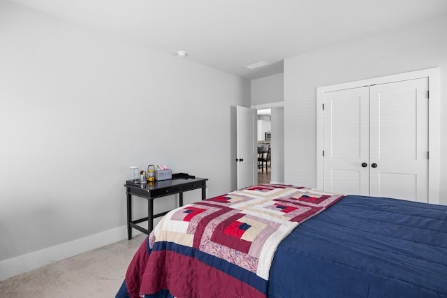 carpeted bedroom featuring a closet