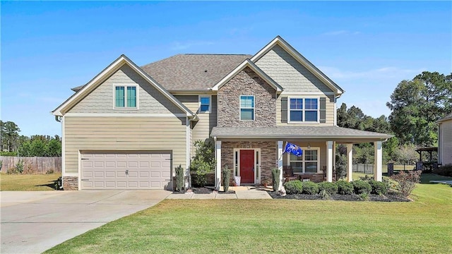 craftsman-style home with a front yard and a garage