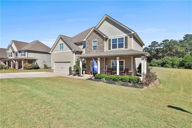 craftsman-style house featuring a front lawn, a porch, and a garage