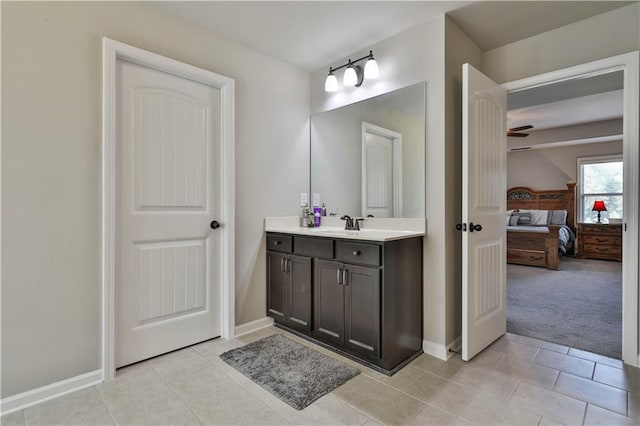 bathroom featuring vanity, tile patterned floors, and ceiling fan