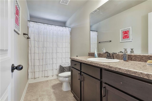 full bathroom with tile patterned floors, vanity, shower / tub combo, and toilet