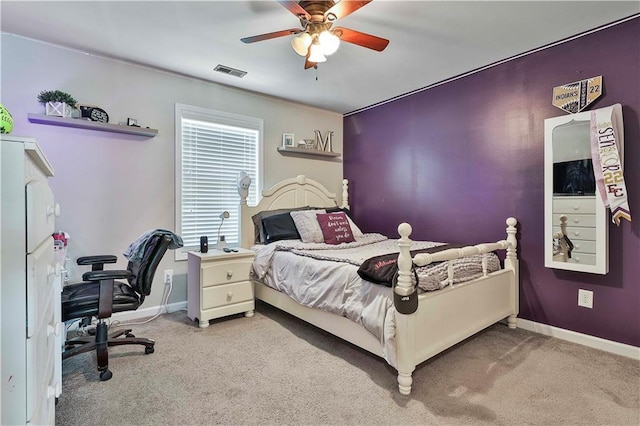 bedroom featuring ceiling fan and light carpet