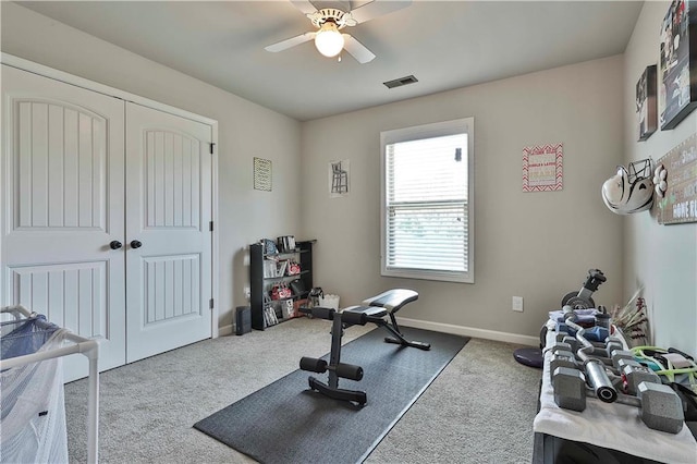 workout area with carpet and ceiling fan