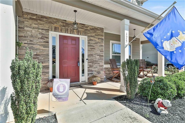 property entrance featuring a porch