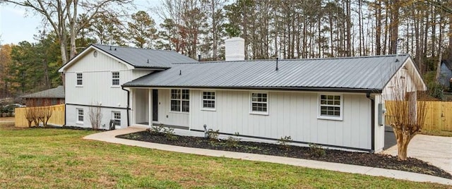 rear view of house with a lawn