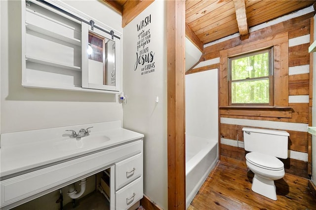 1975 Mack Rd, Douglasville, GA 30135 - bathroom with toilet, wood ceiling, wooden walls, vanity, and a tub to relax in