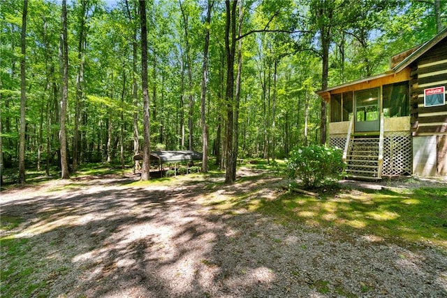 1975 Mack Rd, Douglasville, GA 30135 - view of yard with a sunroom, stairway, and a view of trees