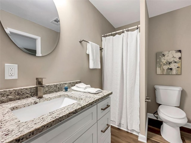 2068 Verbena St NW, Atlanta, GA 30314 - bathroom with wood finished floors, vanity, and a shower with curtain