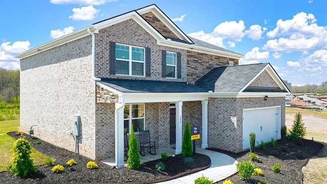 craftsman-style home with a porch and a garage