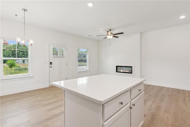 165 Mill Center Blvd Unit 108, Athens, GA 30606 - kitchen featuring light wood-style flooring, hanging light fixtures, a center island, light countertops, and recessed lighting