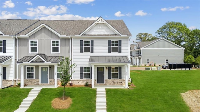 165 Mill Center Blvd Unit 108, Athens, GA 30606 - view of front facade featuring a standing seam roof, a shingled roof, and a front yard