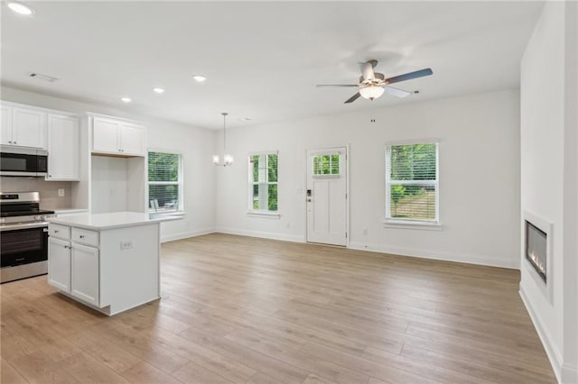 165 Mill Center Blvd Unit 108, Athens, GA 30606 - kitchen featuring stainless steel appliances, ceiling fan, healthy amount of natural light, open floor plan, and recessed lighting