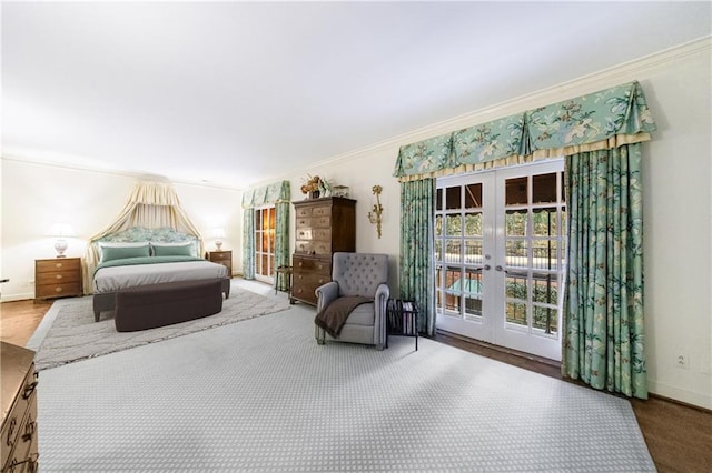 bedroom with access to outside, ornamental molding, and french doors