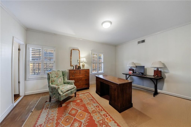 home office featuring crown molding and a healthy amount of sunlight