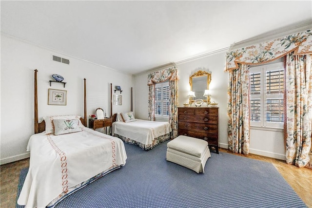 bedroom featuring crown molding