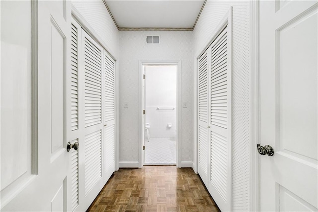 hallway featuring dark parquet floors