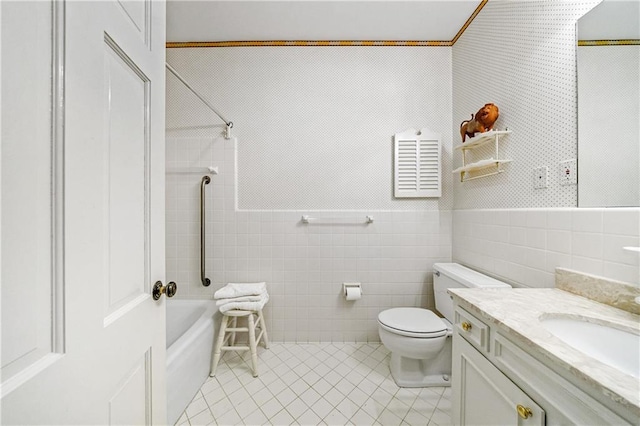 full bathroom with tile walls, tile patterned flooring, vanity, shower / washtub combination, and toilet