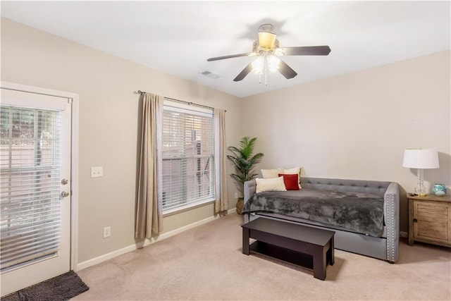 bedroom with light colored carpet and ceiling fan