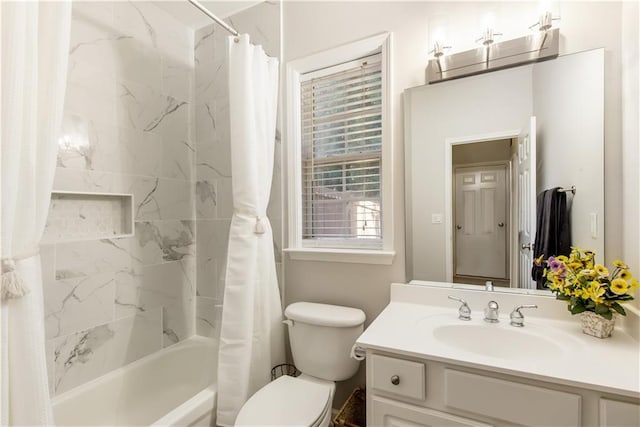 full bathroom featuring vanity, toilet, and shower / tub combo