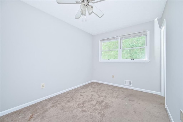 51 Ezzard St, Lawrenceville, GA 30046 - carpeted spare room with baseboards and a ceiling fan