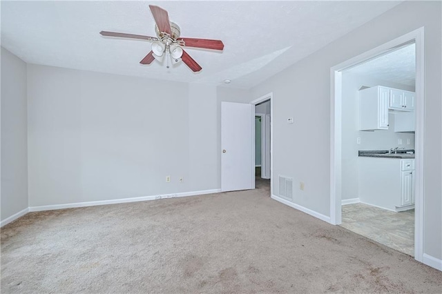 51 Ezzard St, Lawrenceville, GA 30046 - spare room featuring carpet, ceiling fan, and baseboards