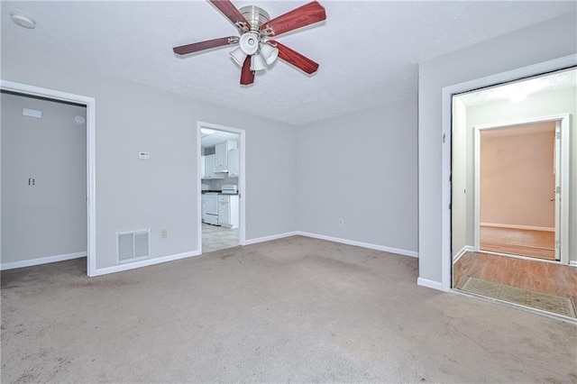 51 Ezzard St, Lawrenceville, GA 30046 - unfurnished bedroom with carpet floors, baseboards, and a ceiling fan