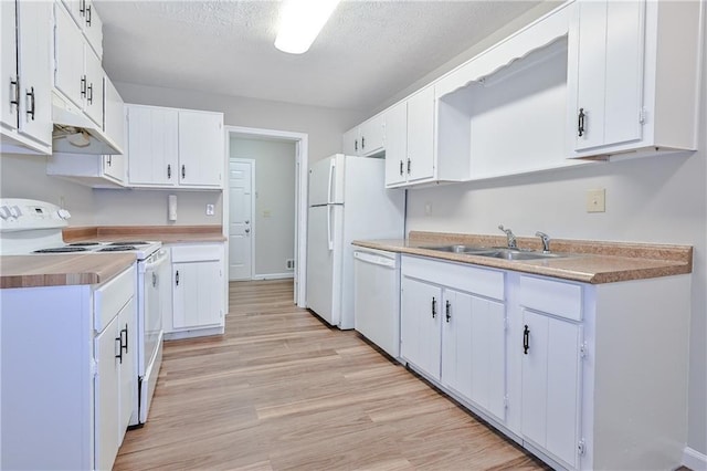 51 Ezzard St, Lawrenceville, GA 30046 - kitchen with white appliances, a sink, light wood finished floors, under cabinet range hood, and white cabinets