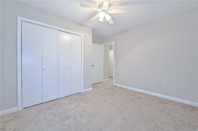 51 Ezzard St, Lawrenceville, GA 30046 - unfurnished bedroom featuring carpet floors, a closet, baseboards, and ceiling fan