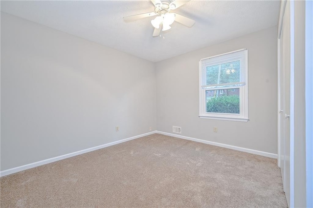 51 Ezzard St, Lawrenceville, GA 30046 - carpeted empty room with baseboards and a ceiling fan