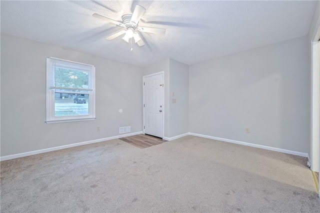 51 Ezzard St, Lawrenceville, GA 30046 - empty room with carpet floors, a ceiling fan, baseboards, and a textured ceiling