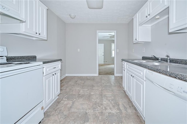 51 Ezzard St, Lawrenceville, GA 30046 - kitchen with white appliances, a sink, under cabinet range hood, ceiling fan, and dark countertops